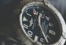 analog watch reading at 2:38